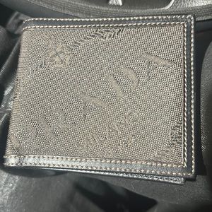 Men’s Prada wallet bifold. Leather inside and trim, cloth outsides. Used once.